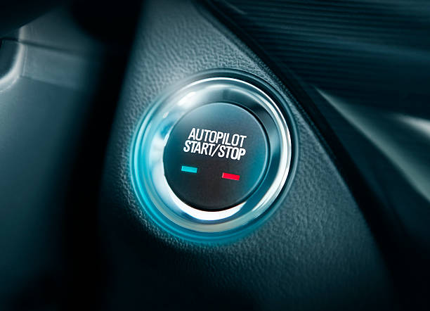 Autopilot button in the car Detail of autopilot start / stop button in modern vehicle autopilot stock pictures, royalty-free photos & images