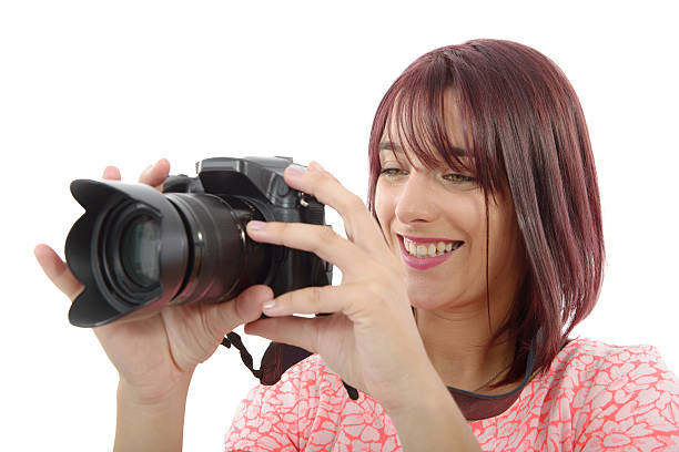 istock Young woman with photo camera.on white background 609950074