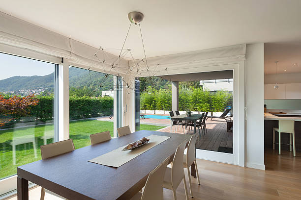 istock open space of luxury house, dining table 609951194
