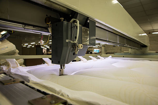 istock Industrial big embroidery machine on textile 609952824