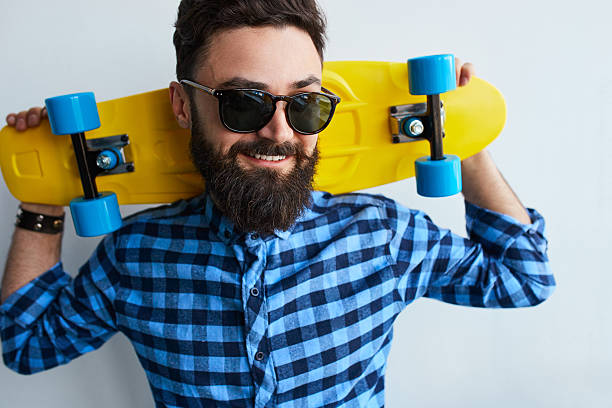 istock Young stylish confident happy handsome man with skateboard 609952840