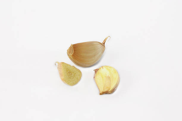istock peeled garlic clove isolated on white background 609952922