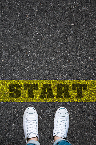 istock shoes standing on a road with the word START 609952952