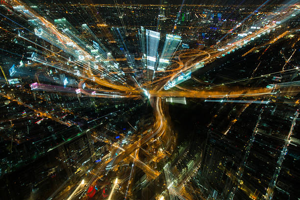 istock Abstract blurred Tolls way, expressway night time and building b 609953320