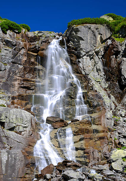 istock Skok waterfall in High Tatras mountains 609953378