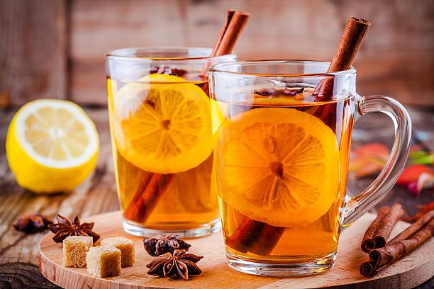 istock hot tea with lemon, anise and cinnamon in glass mugs 609953516