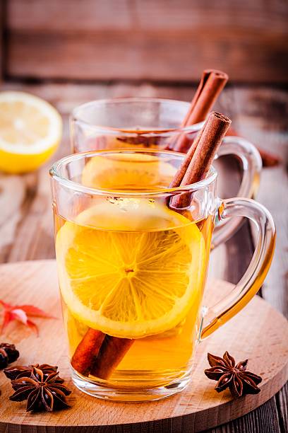 istock hot tea with lemon, anise and cinnamon in glass mugs 609953646