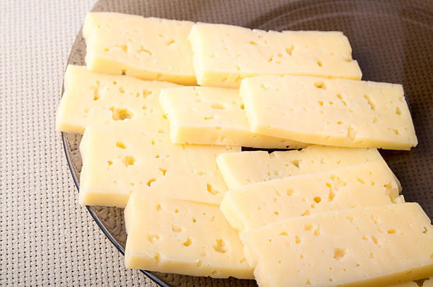 istock Group slices dry hard yellow cheese 609954492