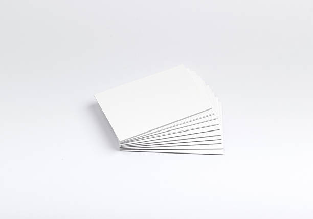 istock Business cards isolated on white 609954770