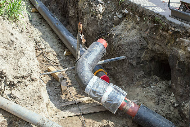 istock Two Pipes in the Earthen Trench  for Making the Pipeline 609955446