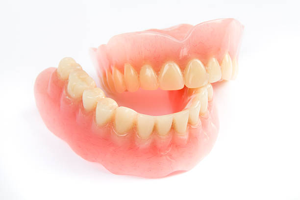 istock Dental smile jaws teeth on white background. Tooth prosthesis. 609955550