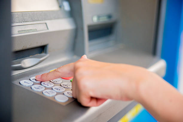 istock Photo of Woman using ATM 610004174
