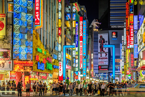 Tokyo, Japan, May 12, 2016: City street night with crowd people waiting for crosswalk in Shinjuku town. Shinjuku is a special ward located in Tokyo for shopping at night.