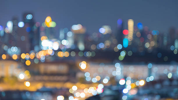 istock Twilight blurred lights city office building 610008660