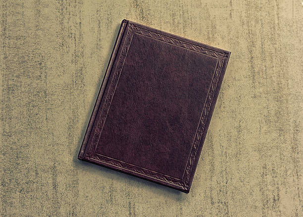 istock book is dark purple on a grey grunge background 610009064