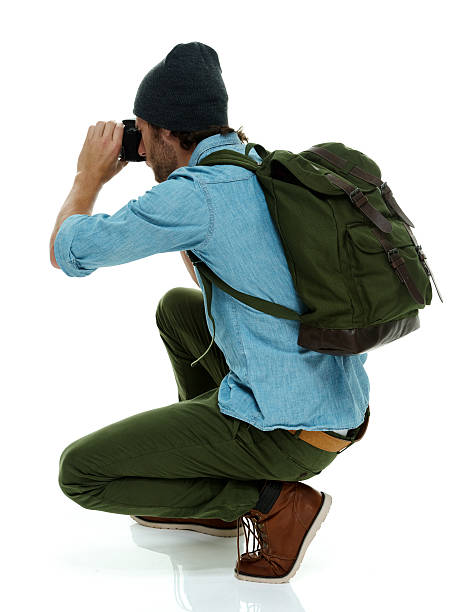 istock Photographer in action with camera 610009266