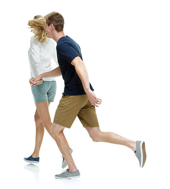 istock Couple holding hands and running 610011516