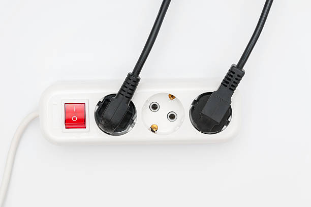 istock Power outlet and power cables on white background 610011580