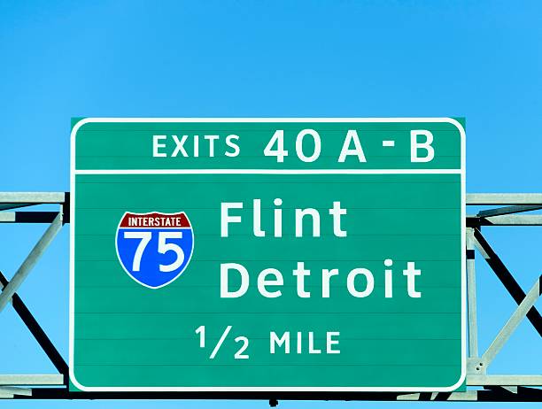 istock Detroit and Flint Michigan Exit Sign 610012786