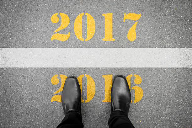 istock Shoes standing at new year 2017 line 610015102