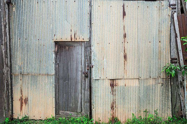 istock rusty zinc barn wall with old wooden door 610017258