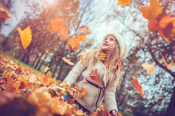 istock Little girl in autumn park 610017726