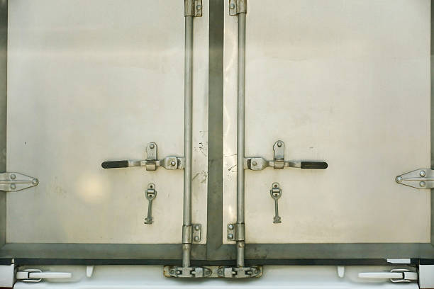 istock Locked back door of truck container. 610018248
