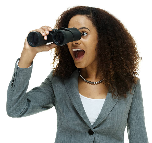 istock Cheerful businesswoman searching with binocular 610019096