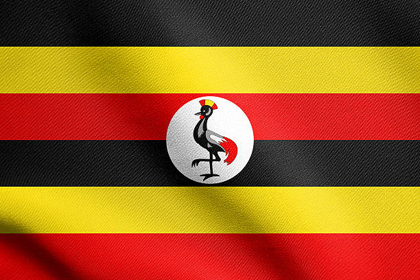 Ugandan national official flag. African patriotic symbol, banner, element, background. Flag of Uganda waving in the wind with detailed fabric texture