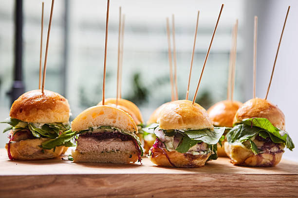 istock Macro close up of multiple appetizing mini chicken burgers 610019448