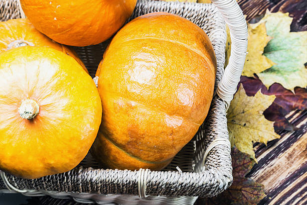 istock pumpkins for Halloween in a basket 610019692