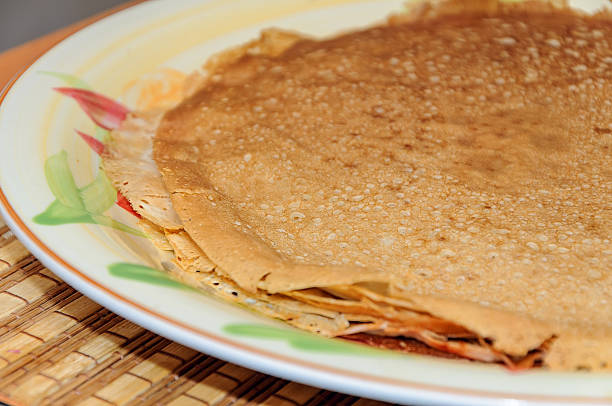 istock Thin russian pancakes on the plate. Maslenitsa is coming 610033536