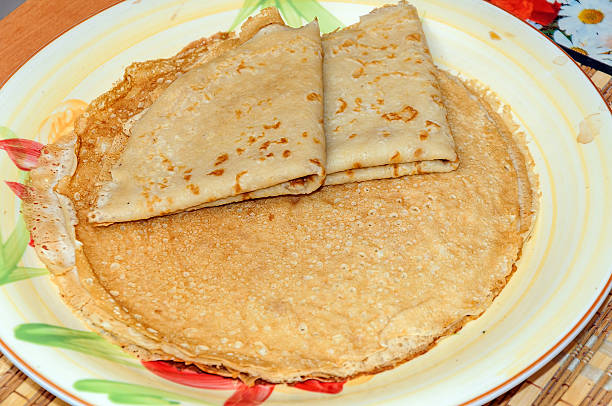 istock Thin russian pancakes on the plate. Maslenitsa is coming 610033602