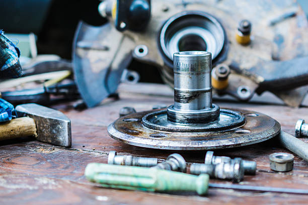 istock Old, oiled wheel hub lies on a wooden table 610034106