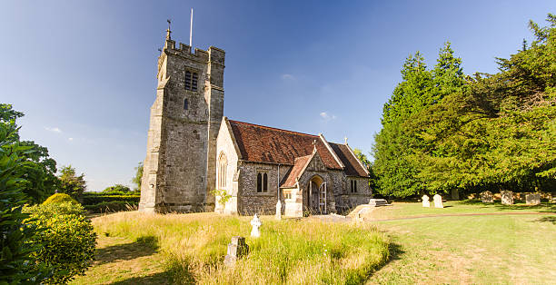 Child Okeford Church in Dorset Summer light on Child Okeford Church in the Blackmore Vale district of north Dorset, England. blackmore vale stock pictures, royalty-free photos & images