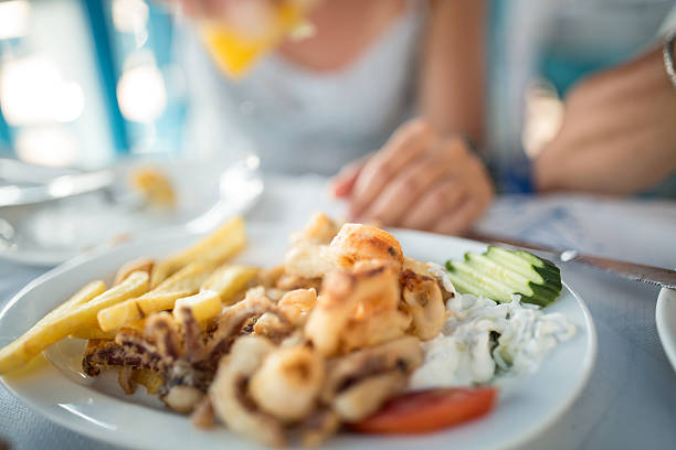 istock women in restaurant have seafood for lunch 610035084
