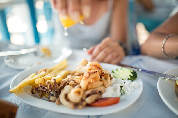 istock women in restaurant have seafood for lunch 610035172