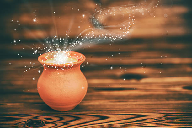 istock concept greeting card of clay pot with mystical miracle light 610035364