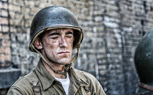 istock World War II US Army Soldier Eyes Closed Sweating 610036084
