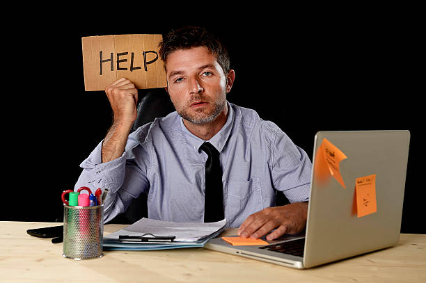 istock tired desperate businessman in office stress working asking for help 610036330