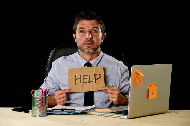 istock tired desperate businessman in office stress working asking for help 610036858