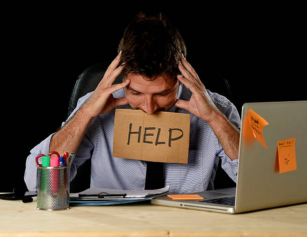 istock tired desperate businessman in office stress working asking for help 610037002