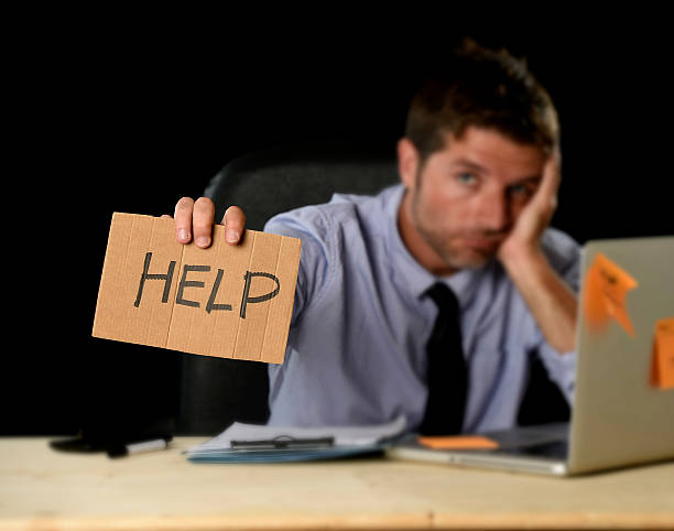 istock tired desperate businessman in office stress working asking for help 610037104