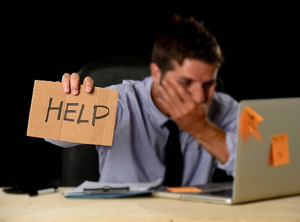 istock tired desperate businessman in office stress working asking for help 610037186