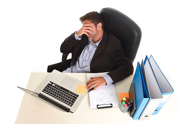 istock tired wasted businessman working in stress at office computer exhausted 610039192