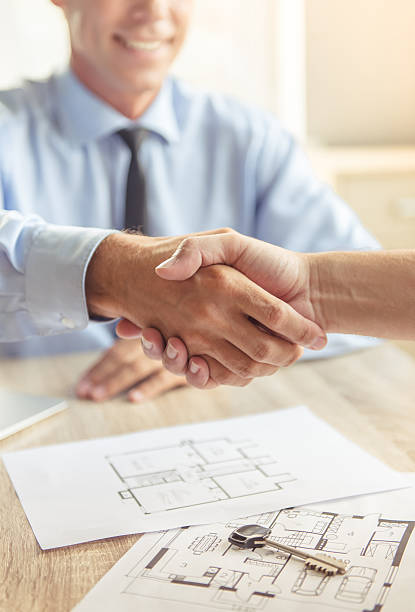 istock Couple visiting Real Estate Agent 610039340