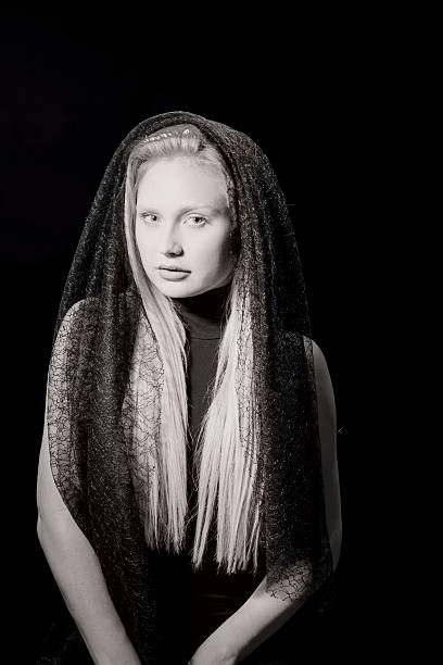 istock Attractive Female With Lace Shawl In Black And White 610039436