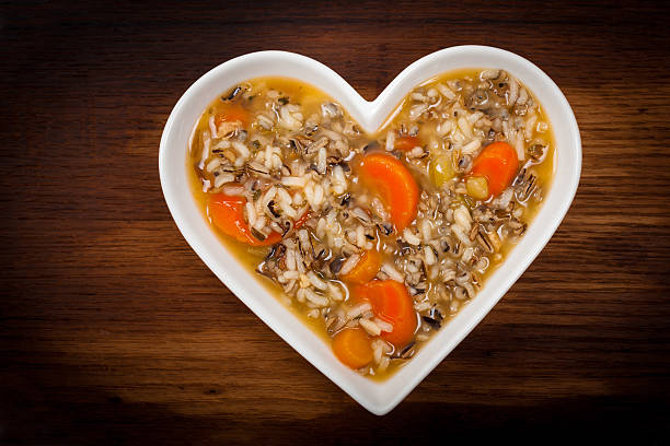 Wild Rice Soup Wild Rice Soup in Heart Shaped Bowl. Selective focus. celery heart stock pictures, royalty-free photos & images