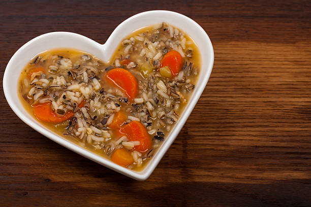 Wild Rice Soup Wild Rice Soup in Heart Shaped Bowl. Selective focus. celery heart stock pictures, royalty-free photos & images