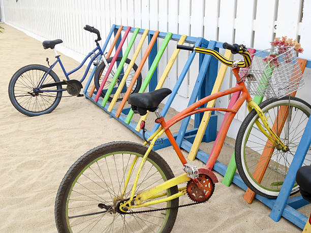 istock Two colorful bicycles parked at a multi-color bike rack 610040866